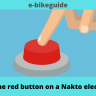 What is the red button on a Nakto electric bike?